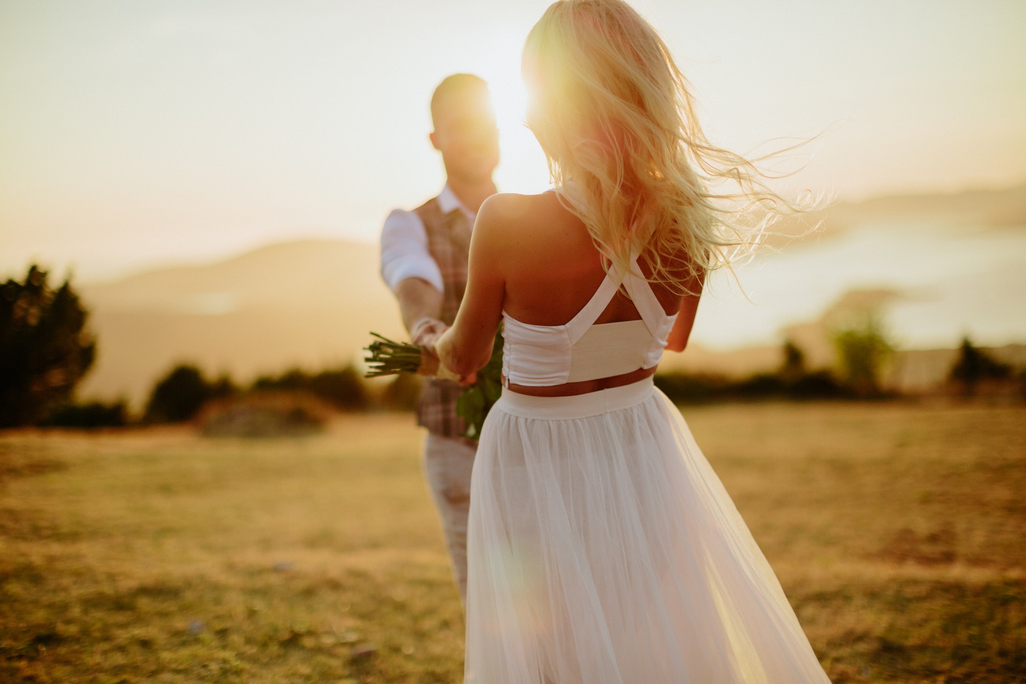 couple happy dance at sunset